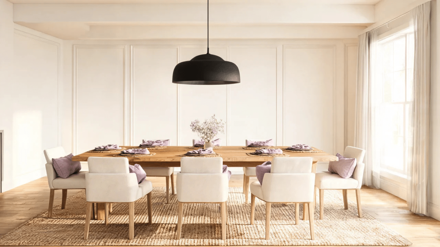 Modern farmhouse dining room with large wood table, upholstered chairs, lilac accents, and pendant lighting