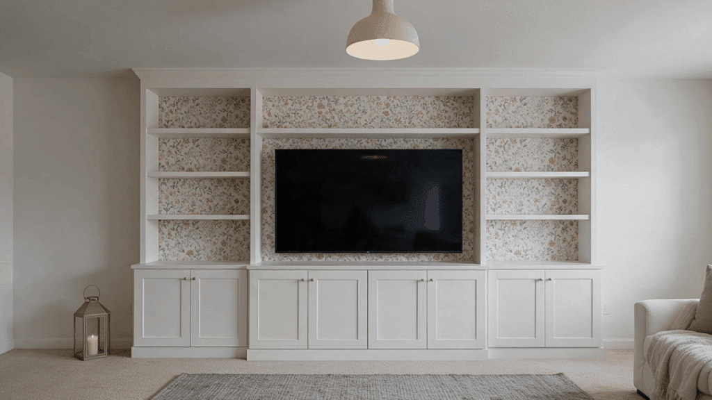 TV lift cabinet IKEA setup with hidden television storage and built-in living room shelves